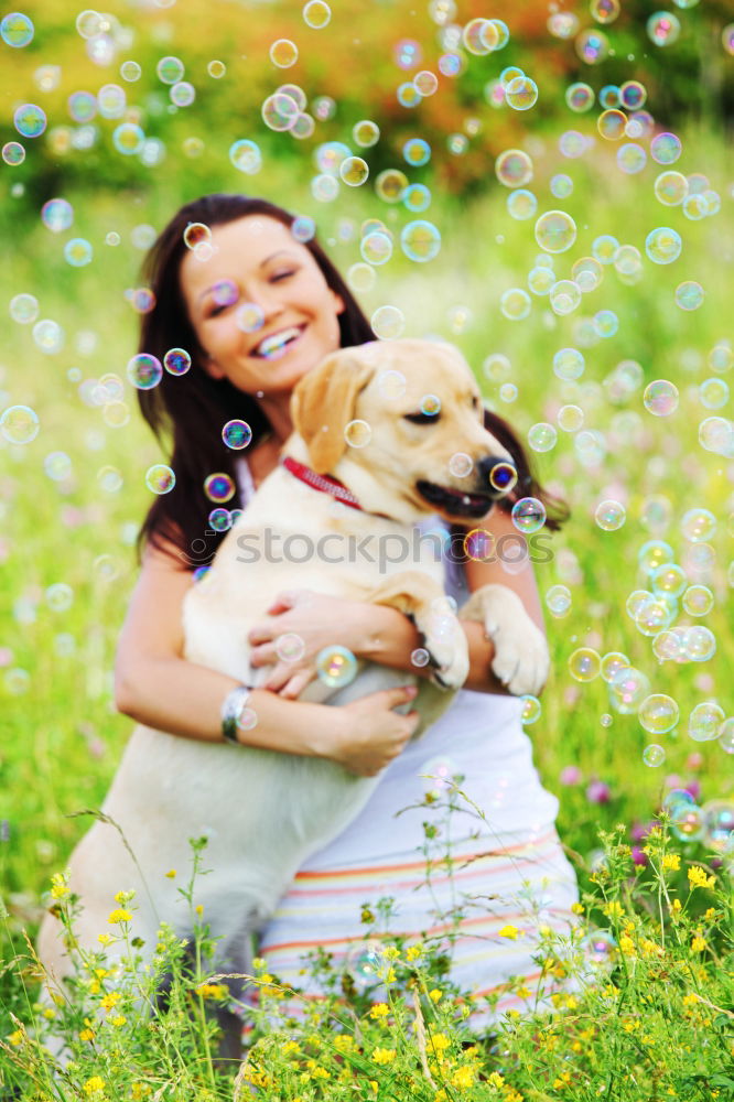 Image, Stock Photo analog medium format photo: young blond Labrador in forest with tall dark haired woman with wild curls smiling at camera