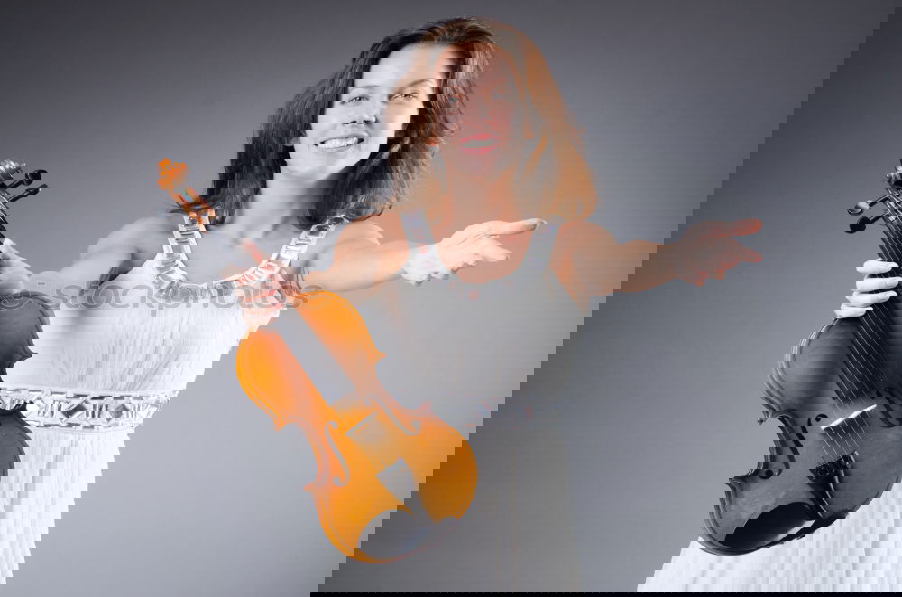 Similar – Image, Stock Photo Pretty woman with violin on field