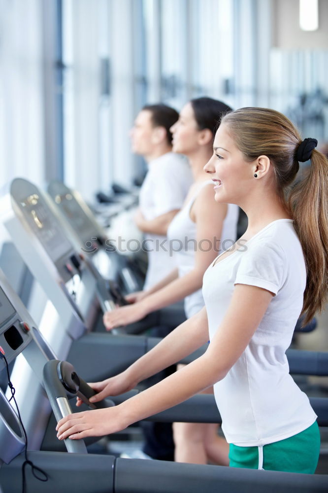 Similar – Concentrated woman in hard bike training session