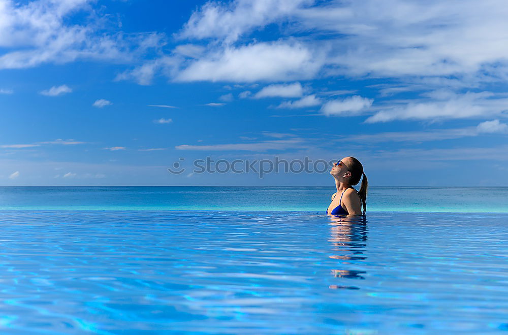 Similar – Woman in lagoon on tropical island