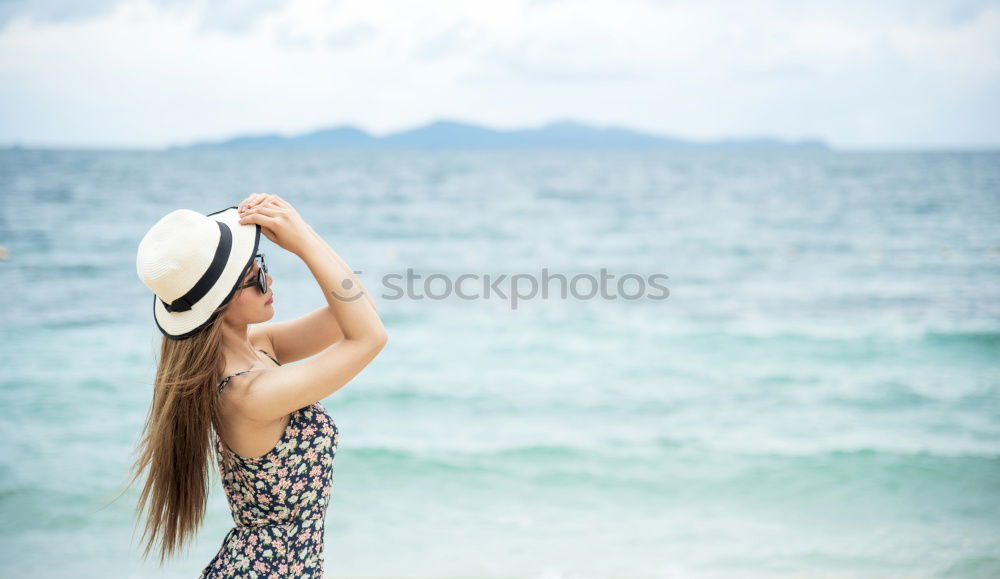 Similar – Image, Stock Photo young girl in a straw hat on the background of the sea