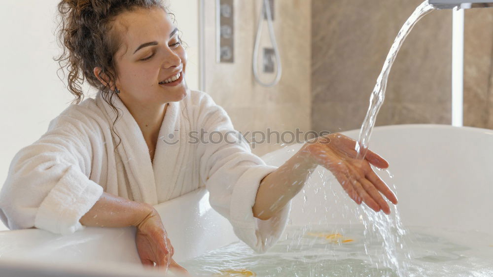 Similar – Image, Stock Photo Woman lying in tub doing hydrotherapy treatment