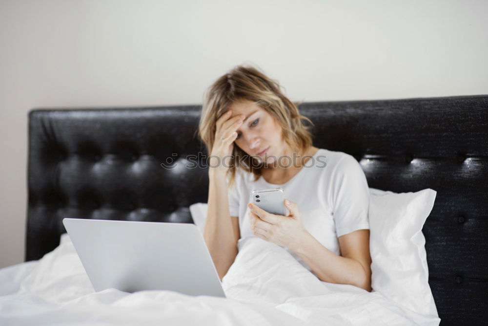 Similar – Young woman who can’t sleep is using her mobile phone