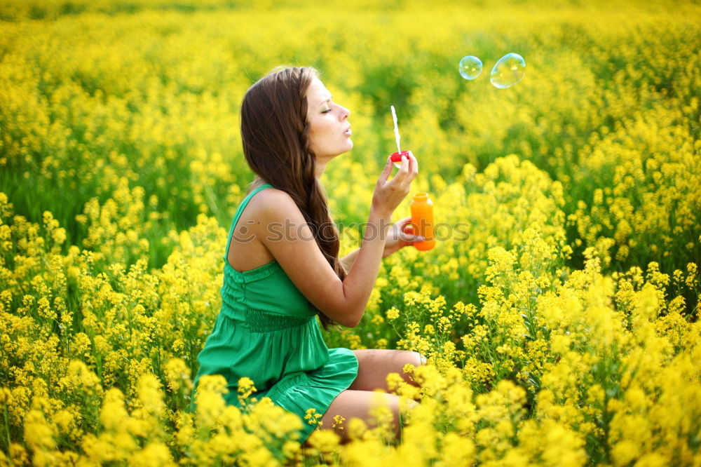 Similar – Pretty girl in youth summer sun with yellow nature flowers. Young woman is attractive, authentic and beautiful. Relaxation and peace from stress, love for environment and dream rest in soul full of happiness.