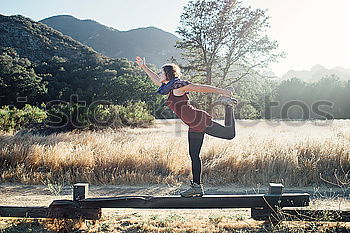 Similar – Woman stretching legs in park