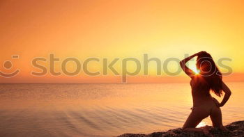 Similar – Happy little girl jumping on the beach at the sunset time