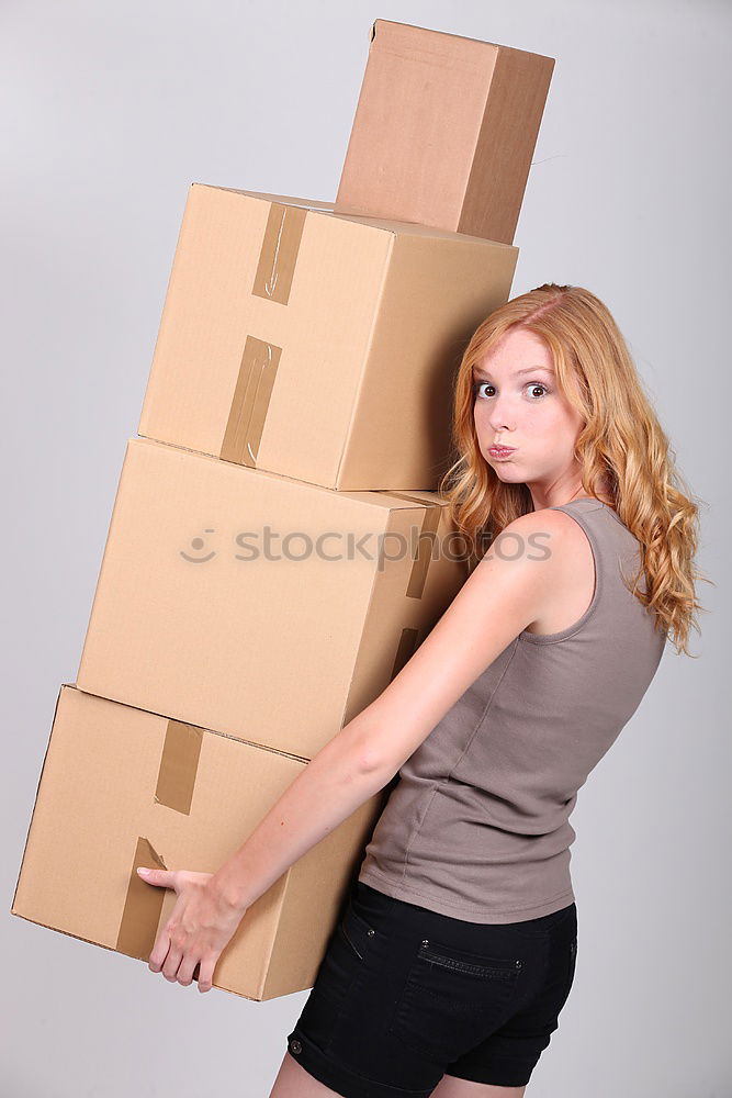 Similar – young woman sits in moving box