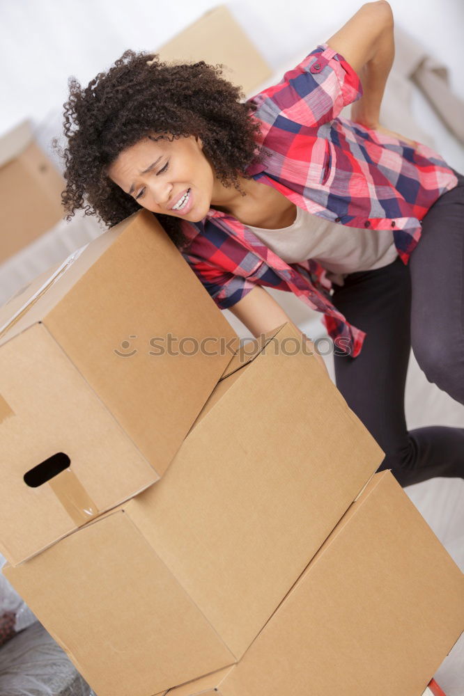 Similar – young woman sits in moving box