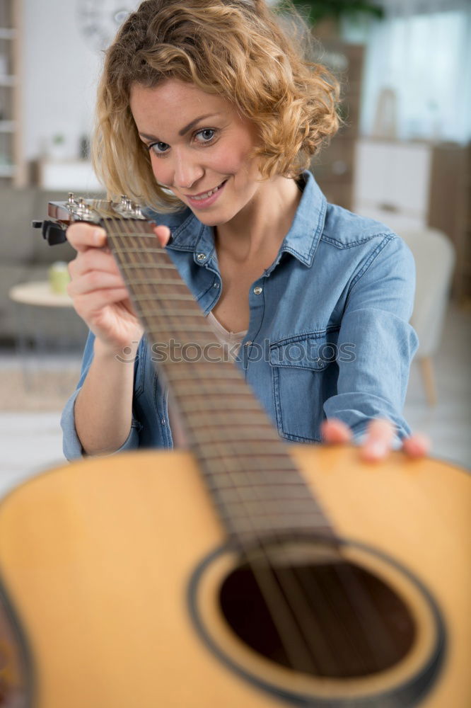 Similar – Beautiful woman playing guitar.