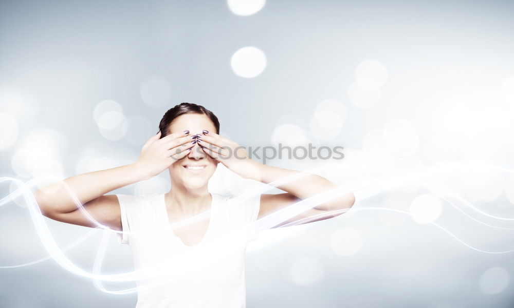 Similar – Woman looks sceptically around the corner