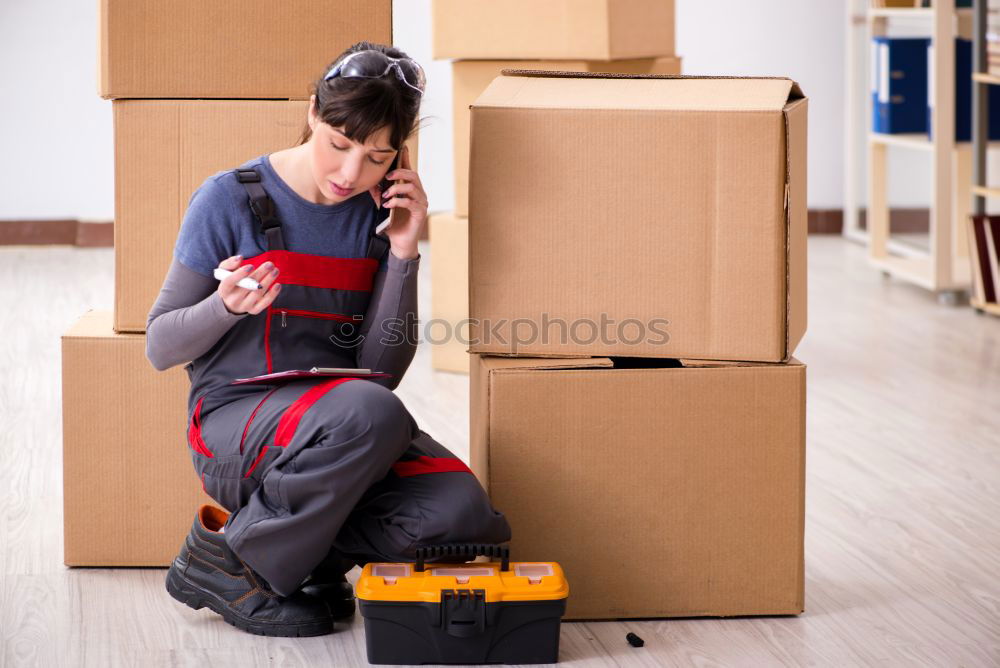 Similar – Man carrying moving boxes