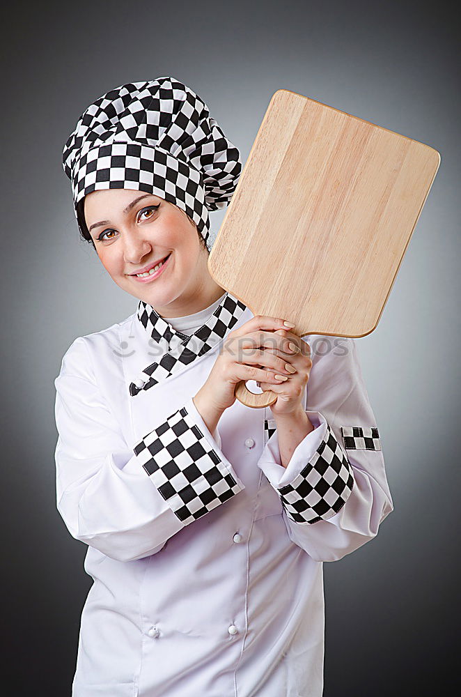 Similar – senior woman with cook hat and rolling pin and spatula on gray background