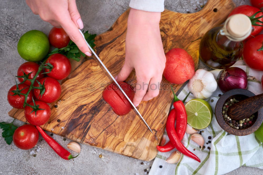 Similar – process of cutting slices of fresh carrots