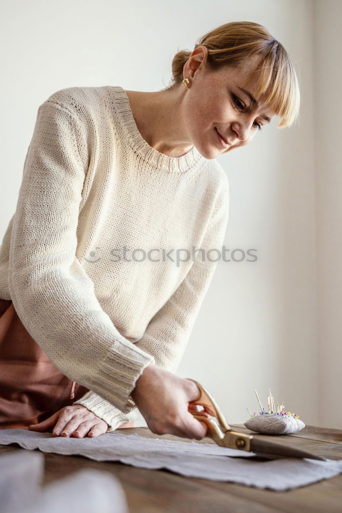 Similar – Image, Stock Photo Young florist packs a wreath of flowers