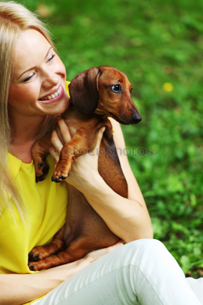 Similar – Happy smiling dog with its pretty young owner