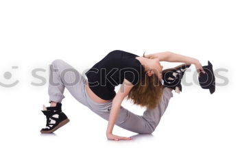Similar – Image, Stock Photo young, slim woman swings her upper body and her long, brunette hair in front of her legs, standing barefoot in front of a white wall