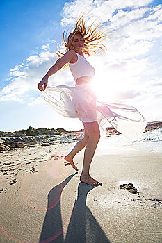 Similar – Anonymous female kicking air on seashore