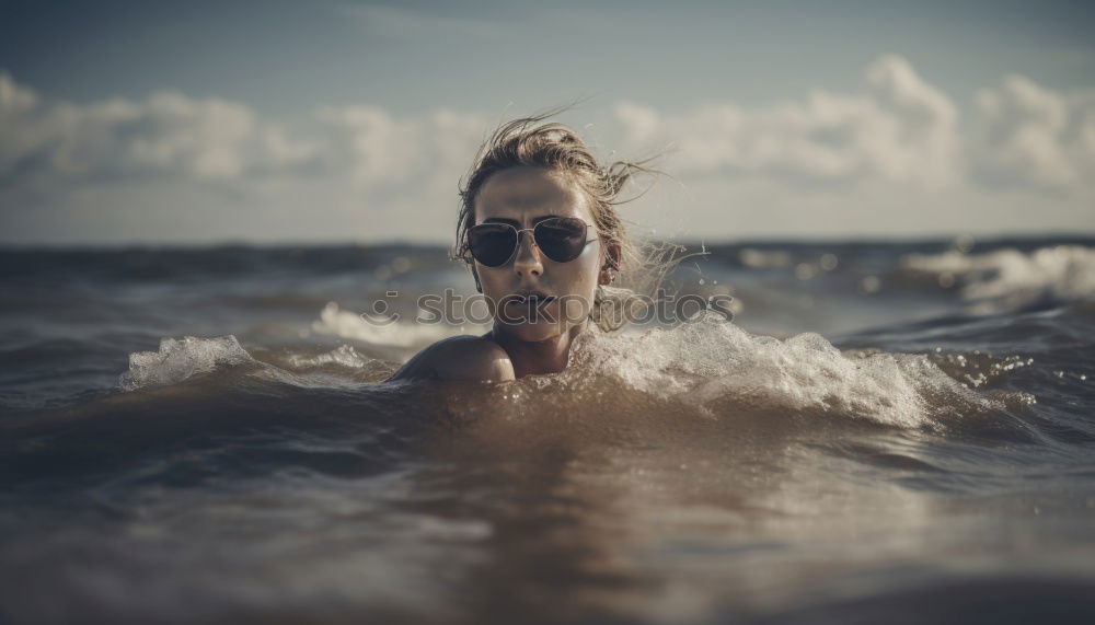 Similar – A young boy learning in body board outdoors in the shoreline in a sunny day of summer