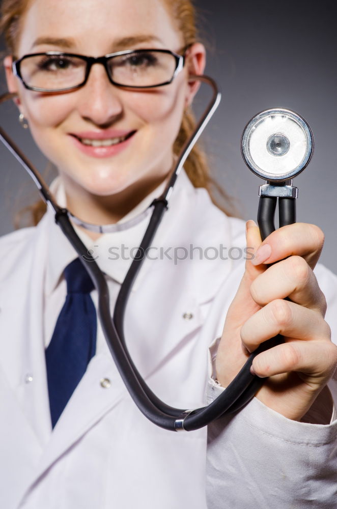 Similar – Female doctor with stethoscope and lab coat