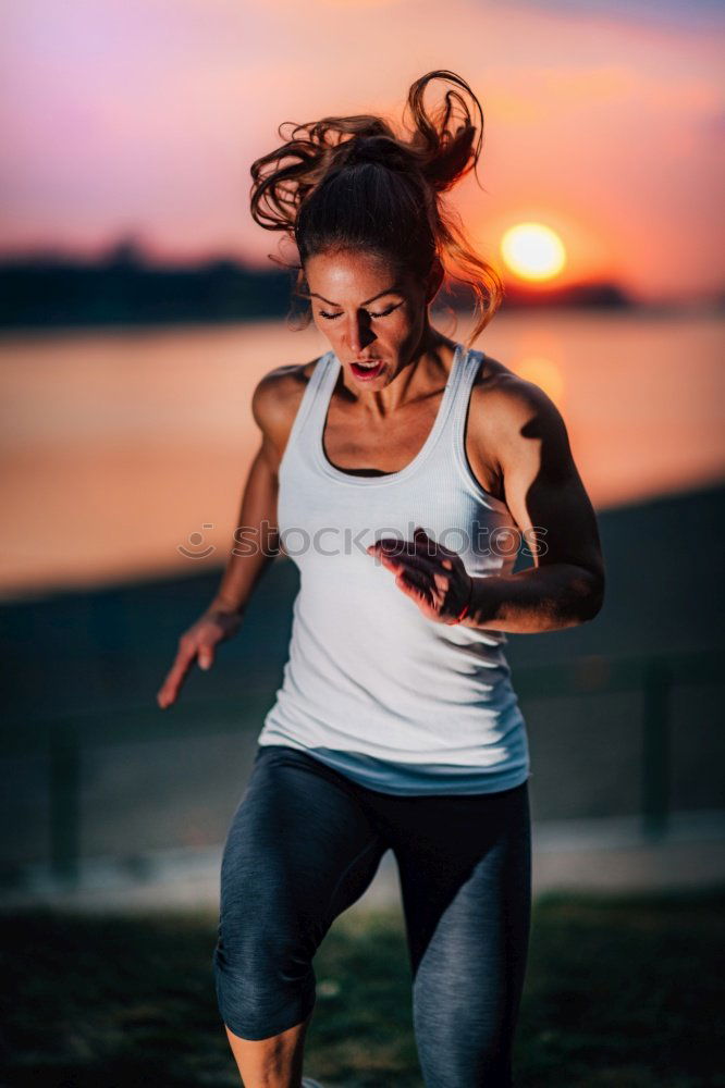 Similar – Female young athlete doing interval training on stairs