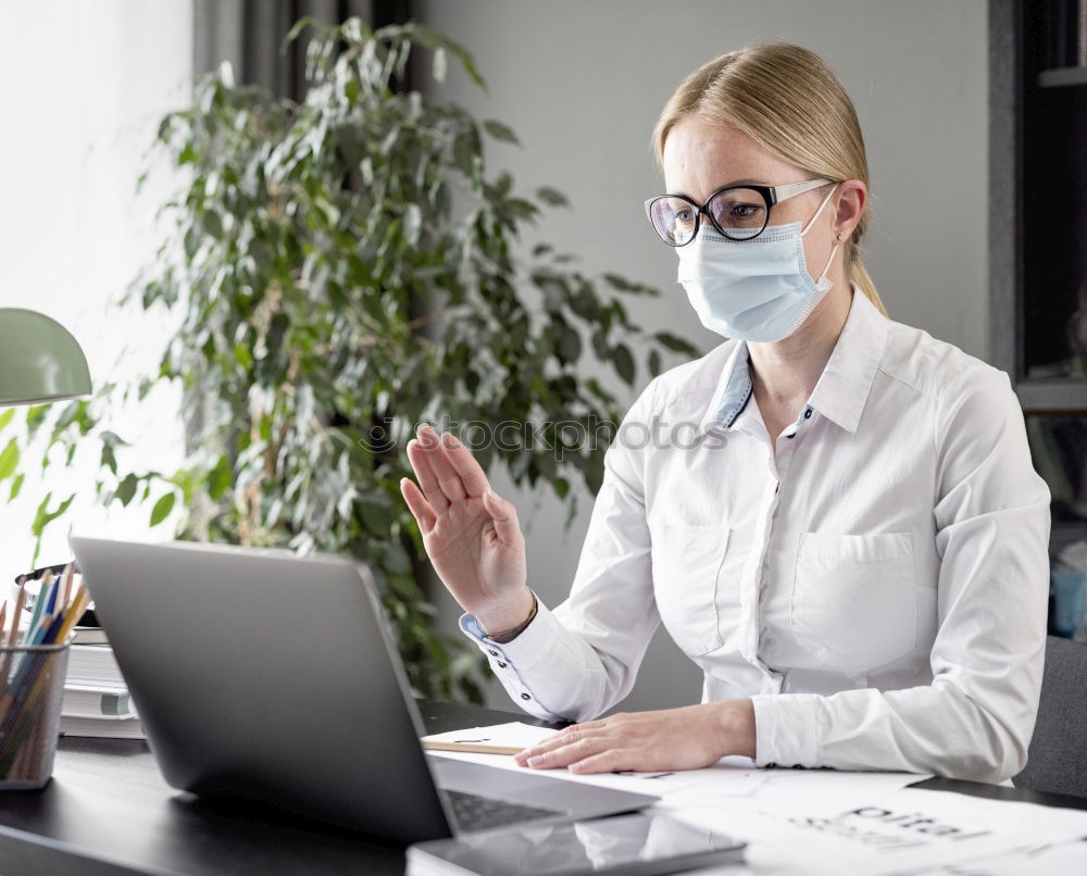 Similar – Young Businessman Wearing Mask Working On Laptop At Hot Desk In Office During Health Pandemic