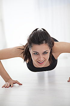 Similar – Black fit woman doing pushups on urban floor.