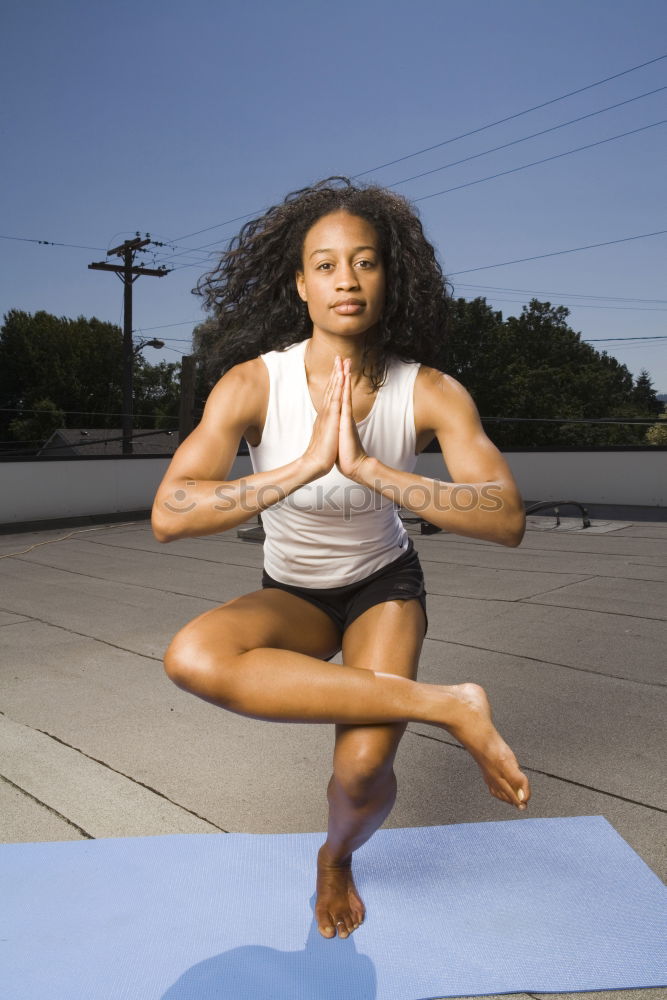 Similar – Image, Stock Photo Black woman, afro hairstyle, doing yoga on promenade.