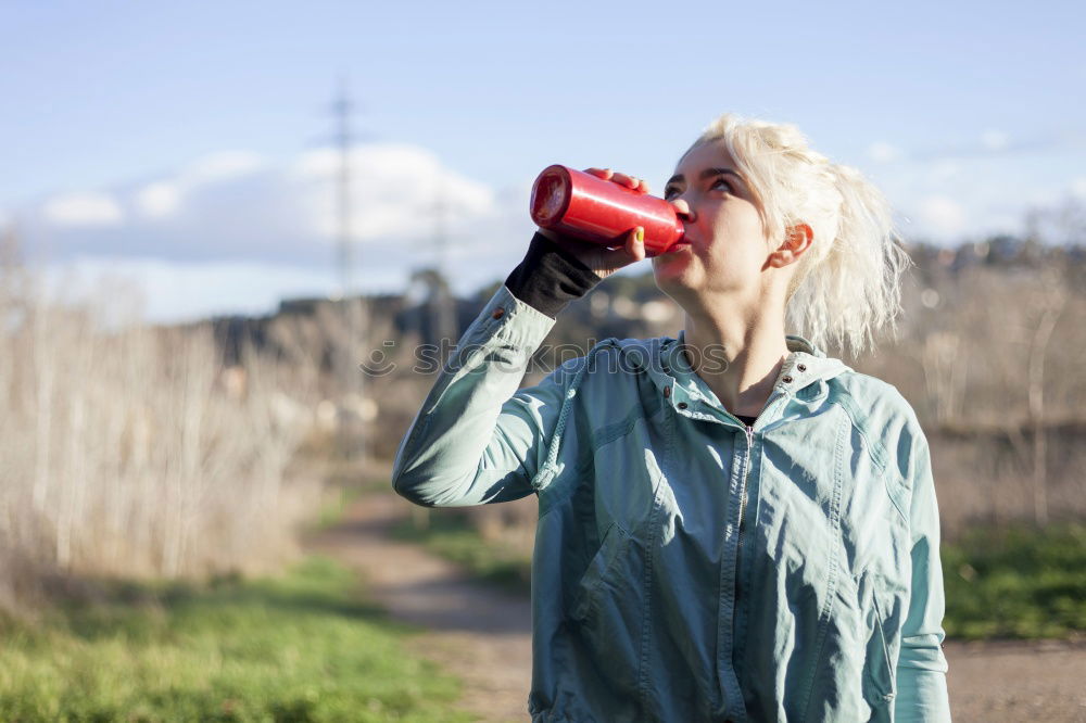 Similar – Image, Stock Photo Blonde girl drinking water during morning jogging