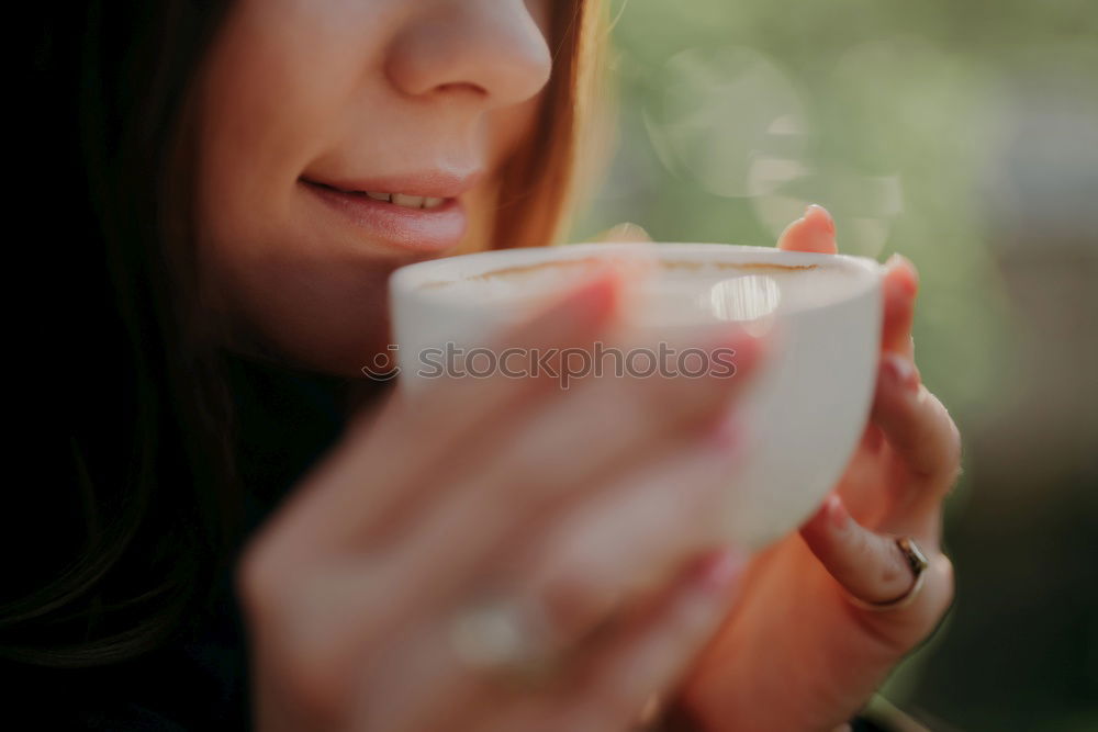 Similar – beauty girl sitting in a coffee shop with a cup in her hands