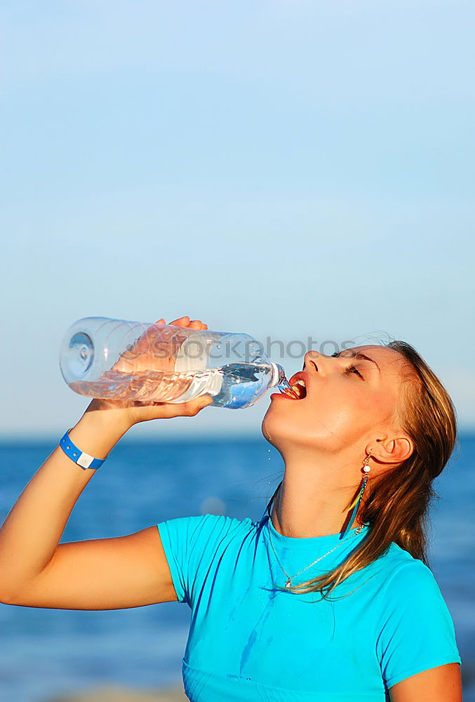 Similar – athletic woman resting and drinking