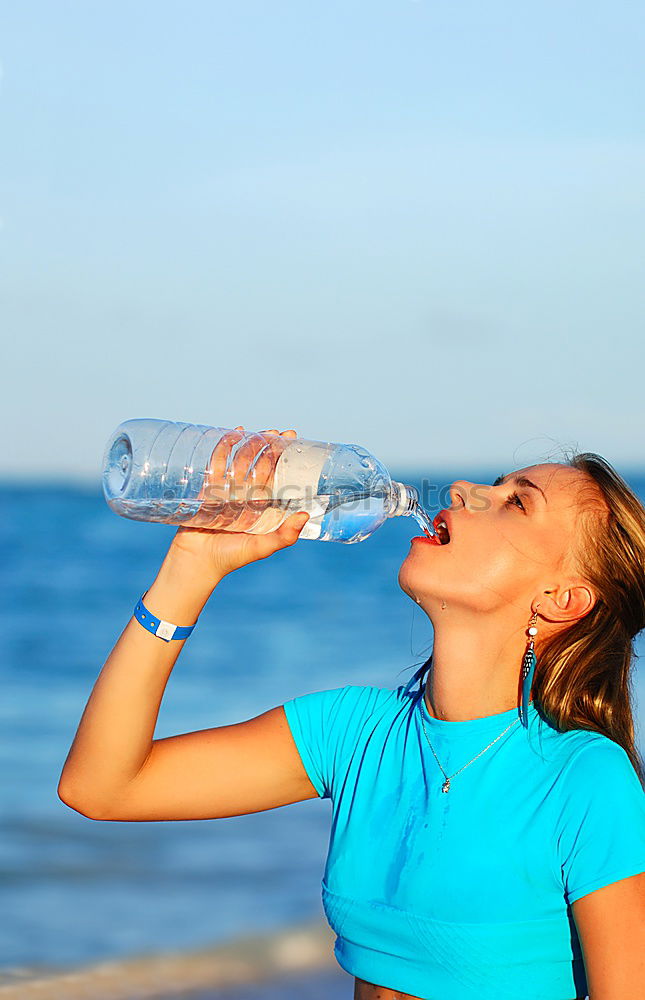 Similar – athletic woman resting and drinking