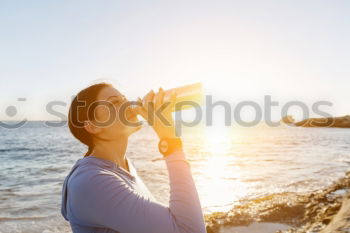 Similar – Image, Stock Photo Blonde girl drinking water during morning jogging