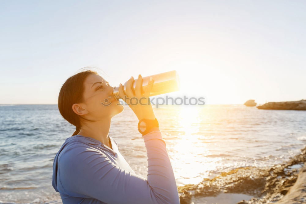 Similar – Fit sporty woman drinking water from a bottle