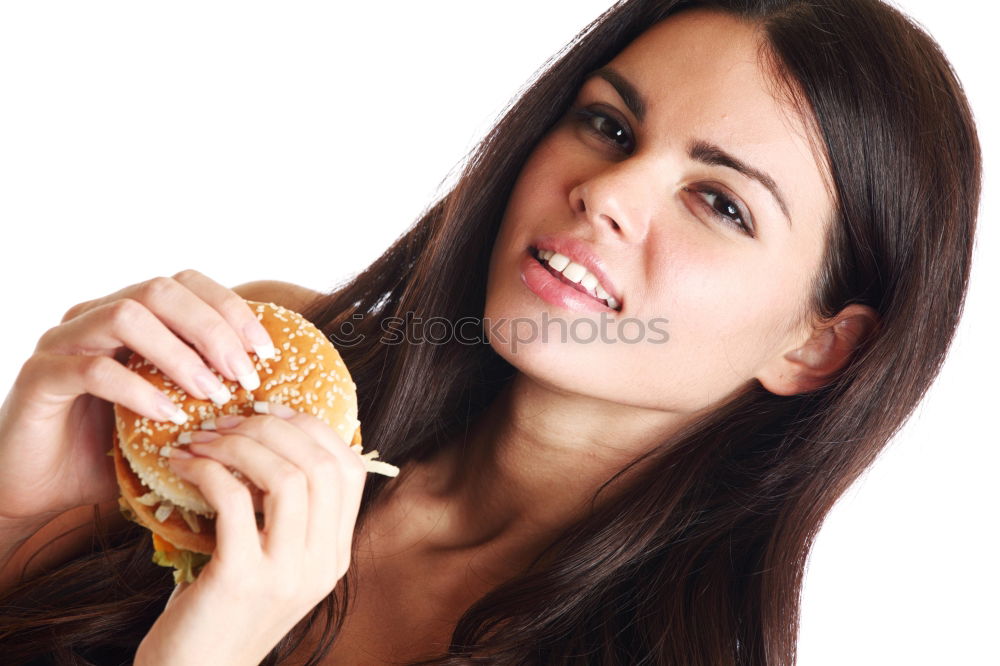 Similar – Woman taking bite of hamburger in restaurant