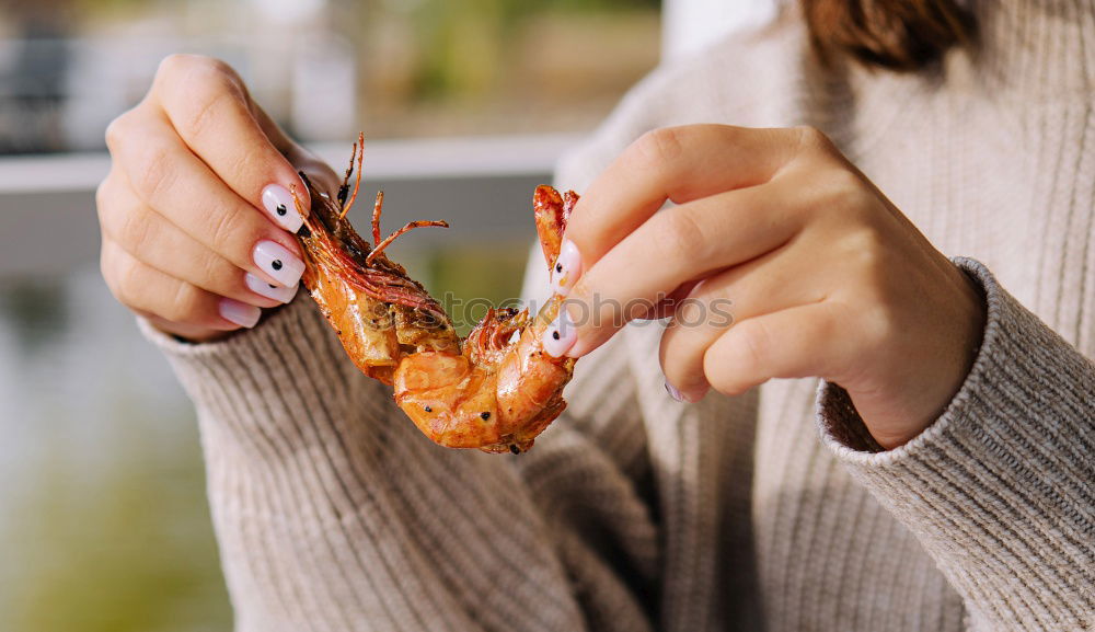 Similar – Crop woman eating sushi