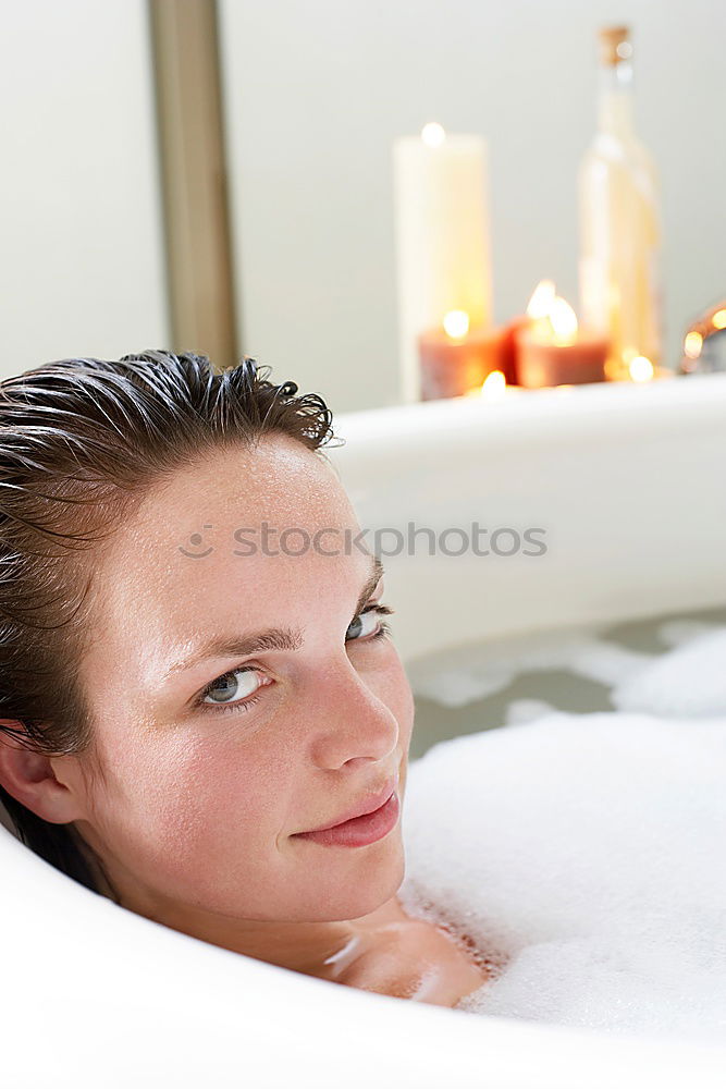 Similar – Image, Stock Photo Woman lying in tub doing hydrotherapy treatment