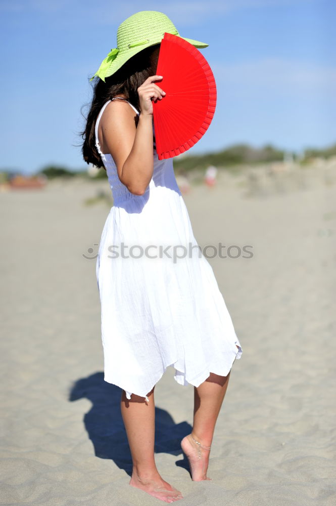 Similar – little girl stands on beach in a special swimsuit for children who can not swim. child in swimsuit, which he kept afloat