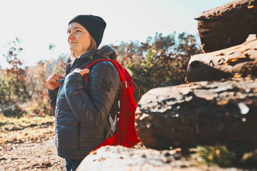 Similar – Hiker closing his partner’s backpack