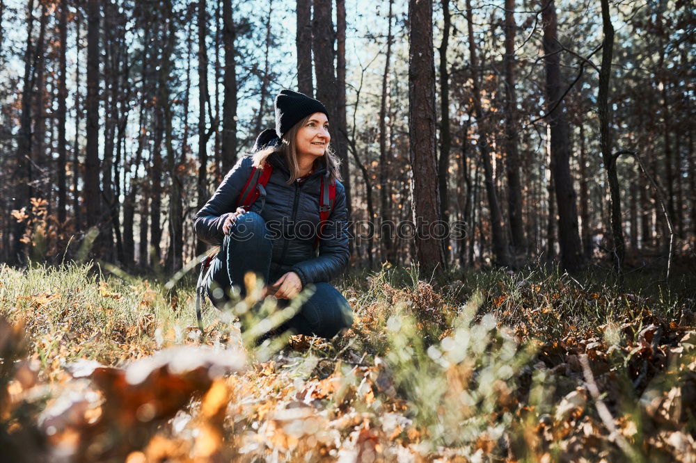 Similar – Image, Stock Photo Hiking, woman hiker enjoying the scenery in the snowy forest