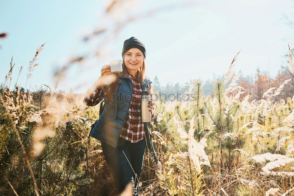 Similar – Girl sitting in autumn forest