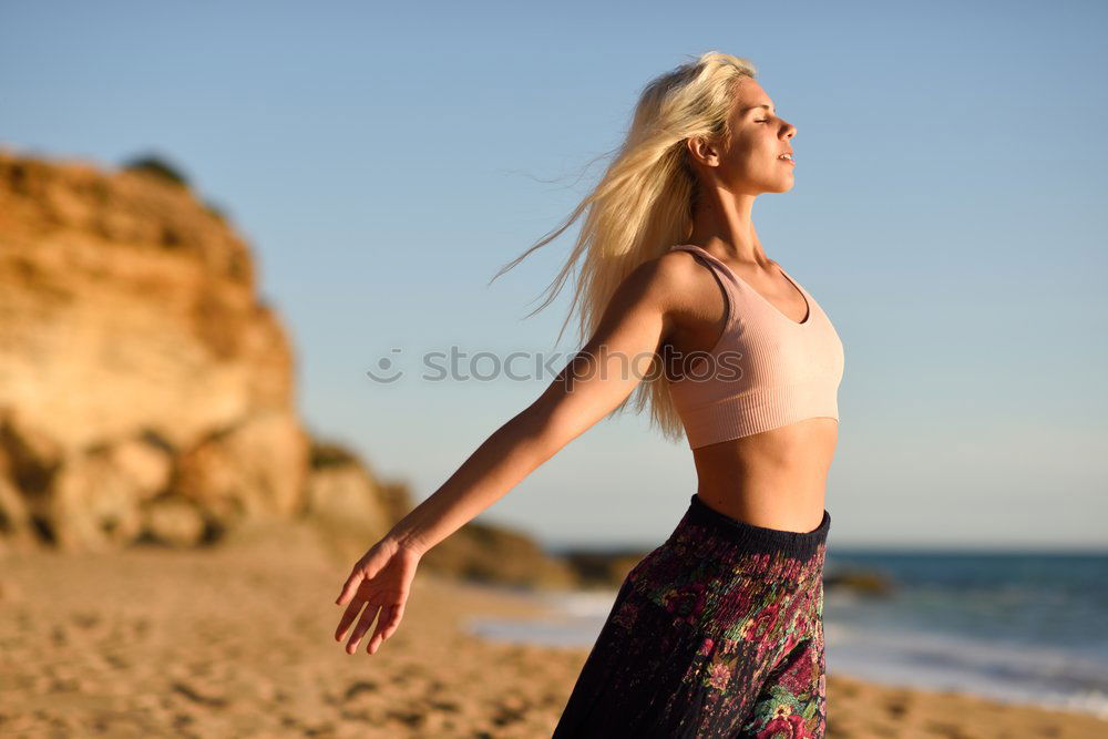 Woman enjoying the sunset on a beautiful beach