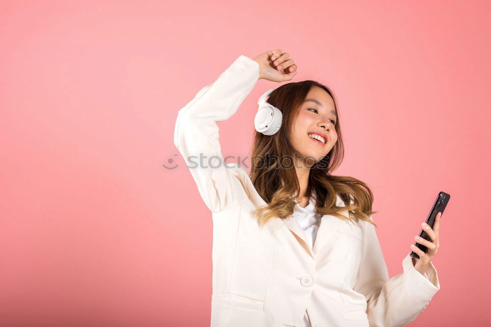 Similar – Happy caucasian women listening to music on smart phone