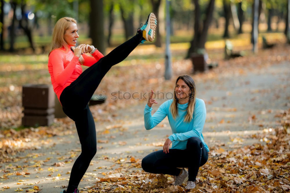 Similar – Woman stretching her body in front of ancient wall in park