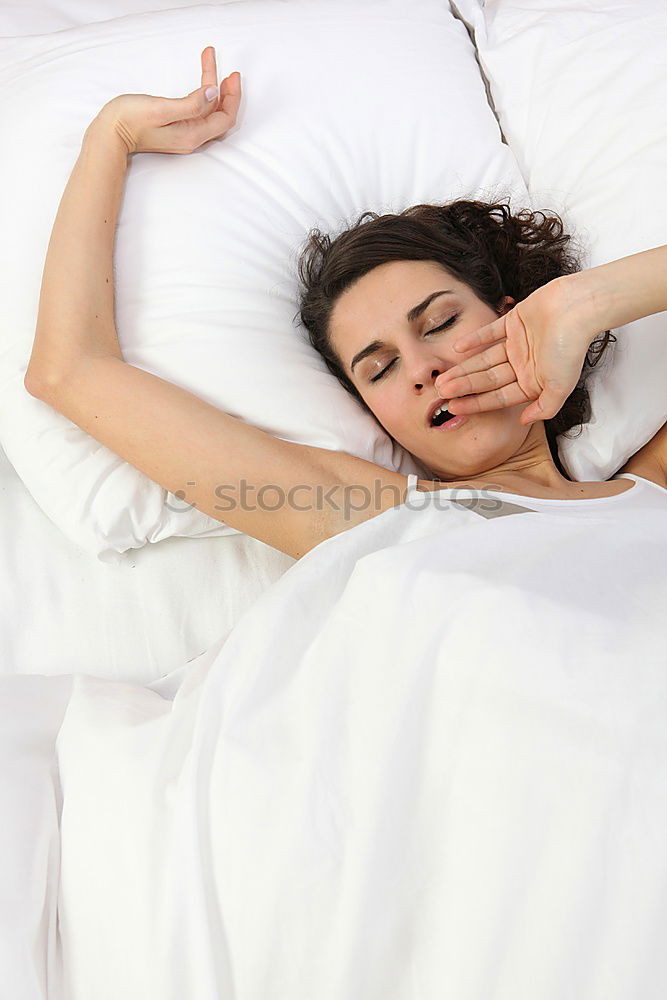 Similar – Portrait of a beautiful adult woman lying on a bed