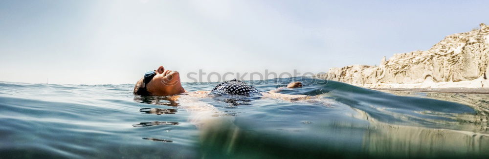 Similar – Image, Stock Photo Man in wetsuit swimming in ocean