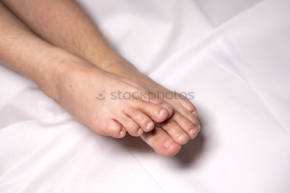 Similar – Image, Stock Photo close up feet of a couple under the white sheets blanket in bed,