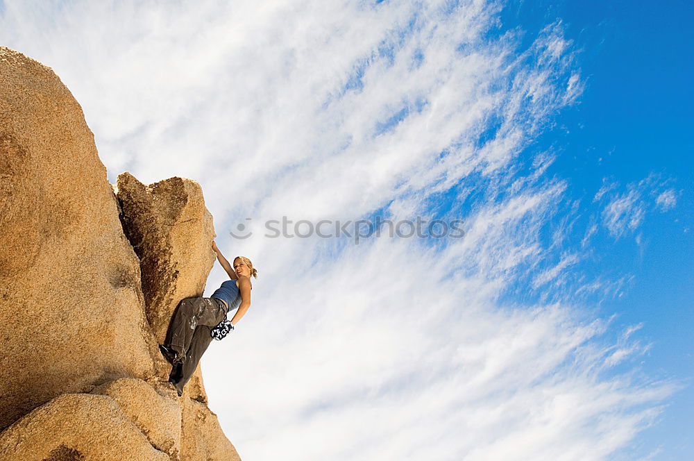 Similar – Image, Stock Photo Rock climber clinging to a cliff.