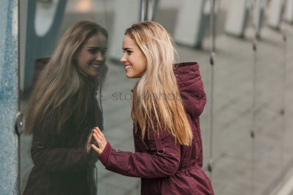 Similar – Two young women talking and laughing on urban steps