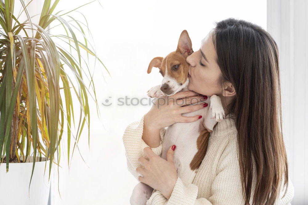 Similar – Image, Stock Photo Young woman holding her puppy