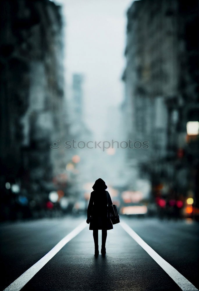 Man with dog is walking on a path in dense fog